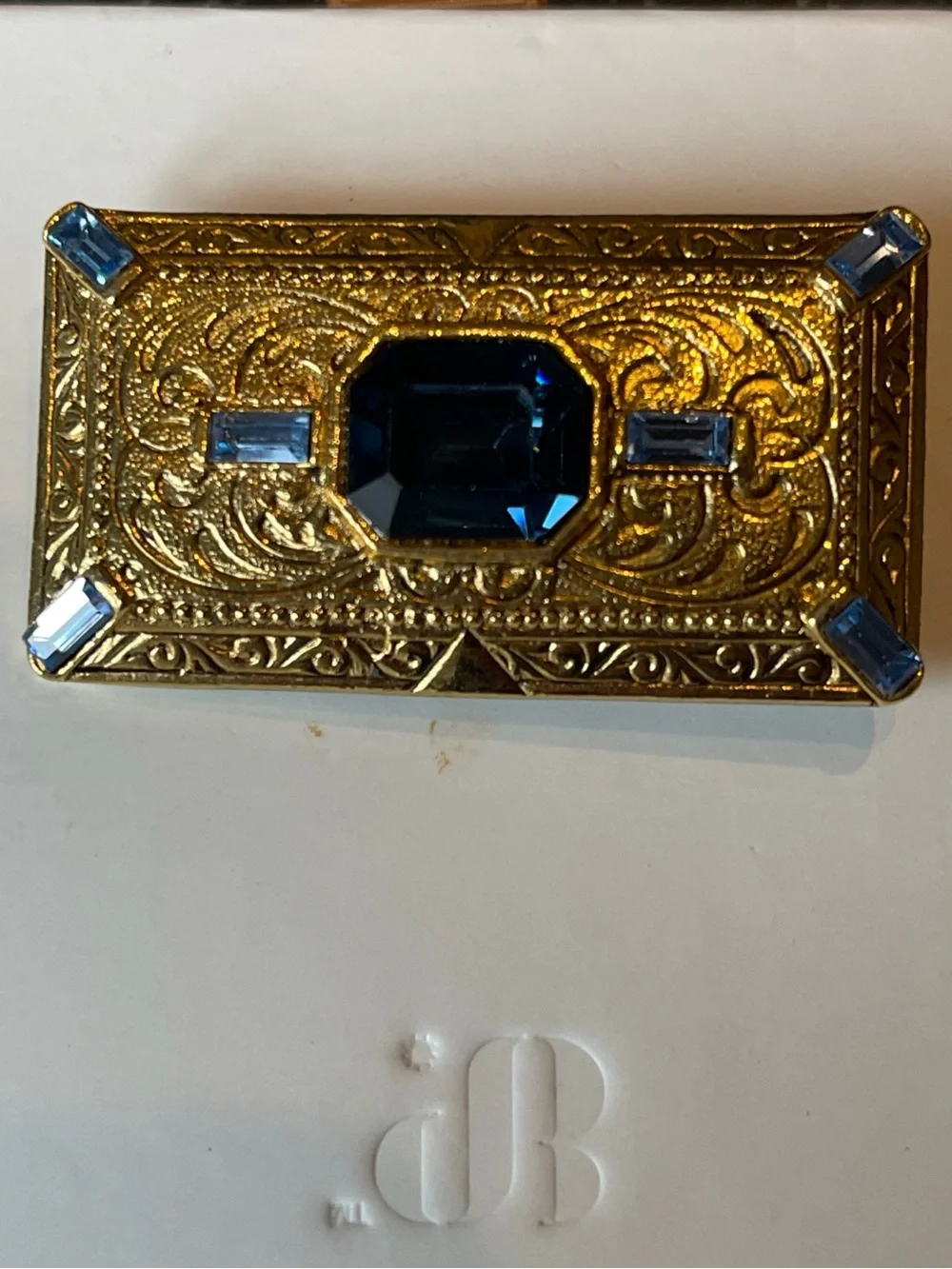 1928 brand gold-tone rectangular brooch with blue glass rhinestones - EUC